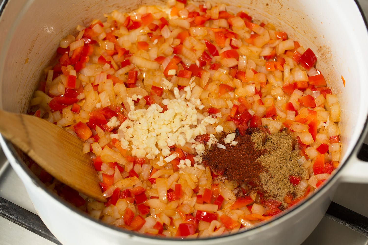 Vegetables in pot sautéing. 