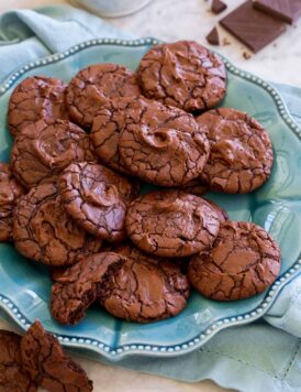 Brownie Cookies shown piled together on a turquoise serving plate.