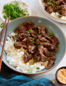 Serving of beef bulgogi paired with rice in a light blue bowl.