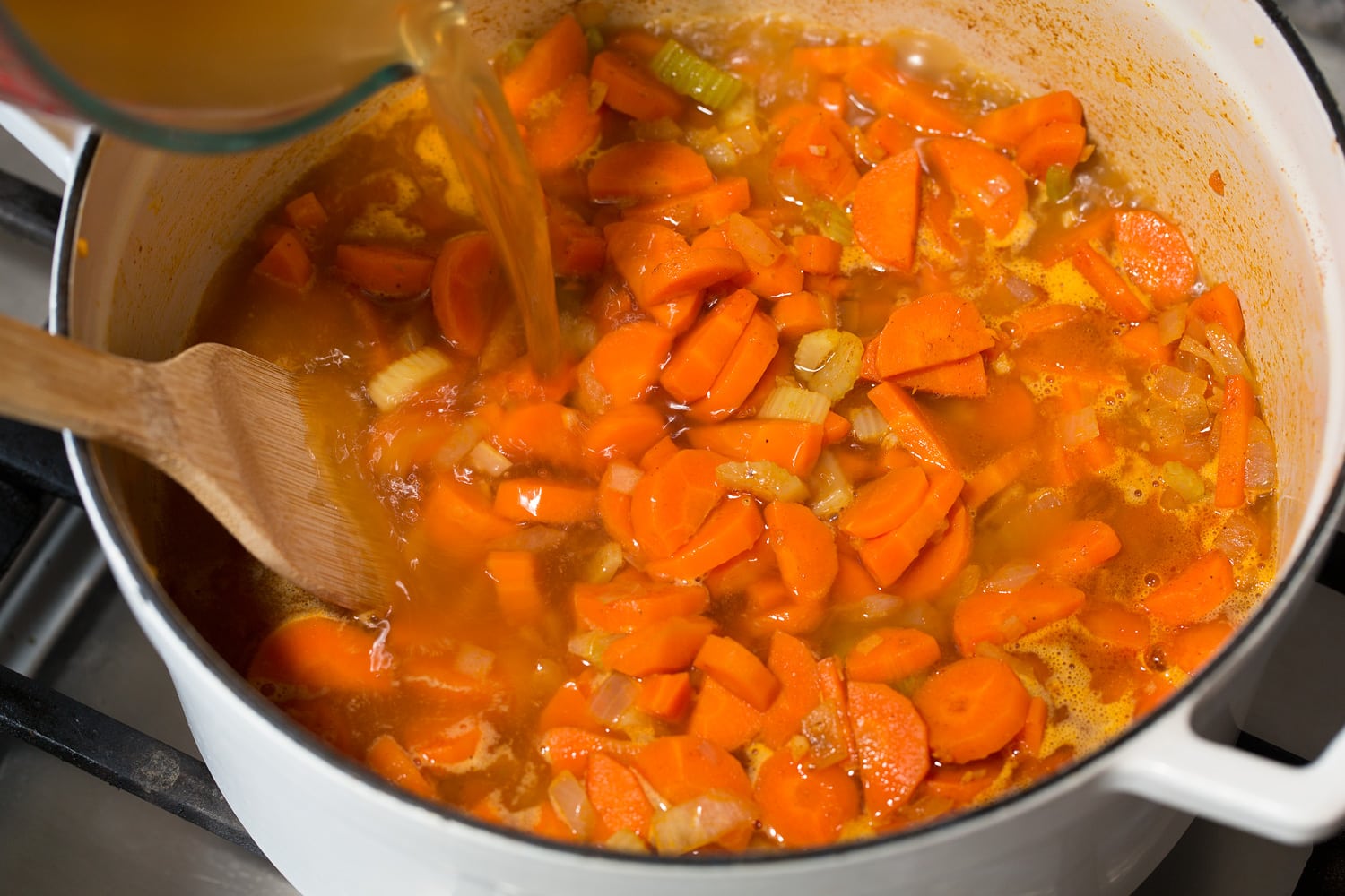 Vegetable broth added to soup.