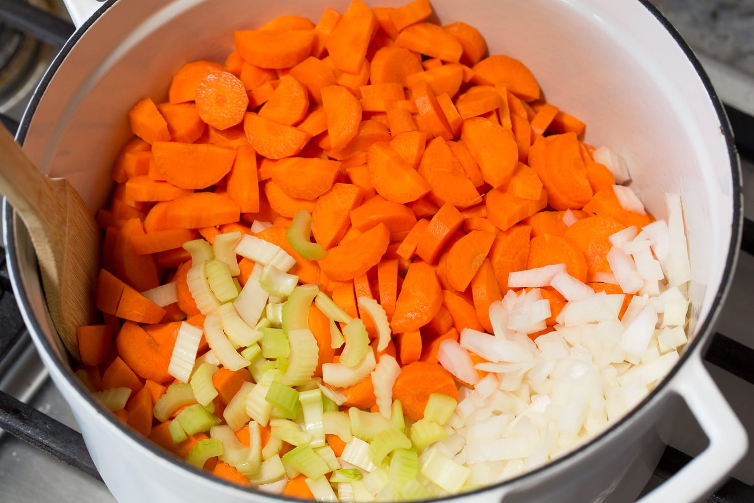 Carrots, celery and onion sauteing in pot.