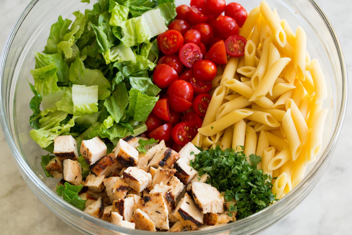 Pasta salad ingredients shown before adding dressing.