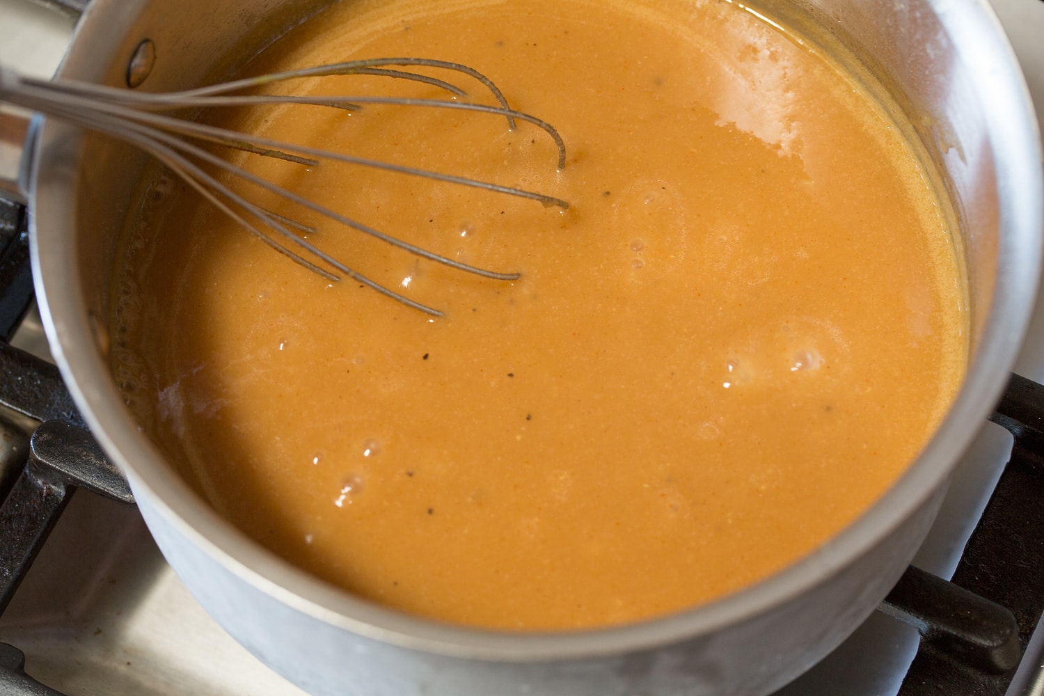 Completed chicken gravy in stainless saucepan.