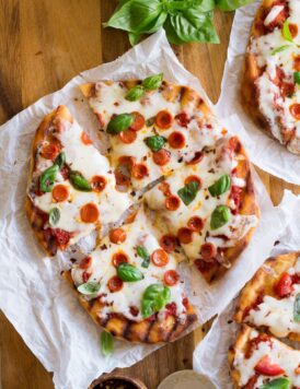 Grilled pizza cut into slices.