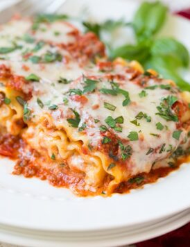 A close up of lasagna roll ups on a plate