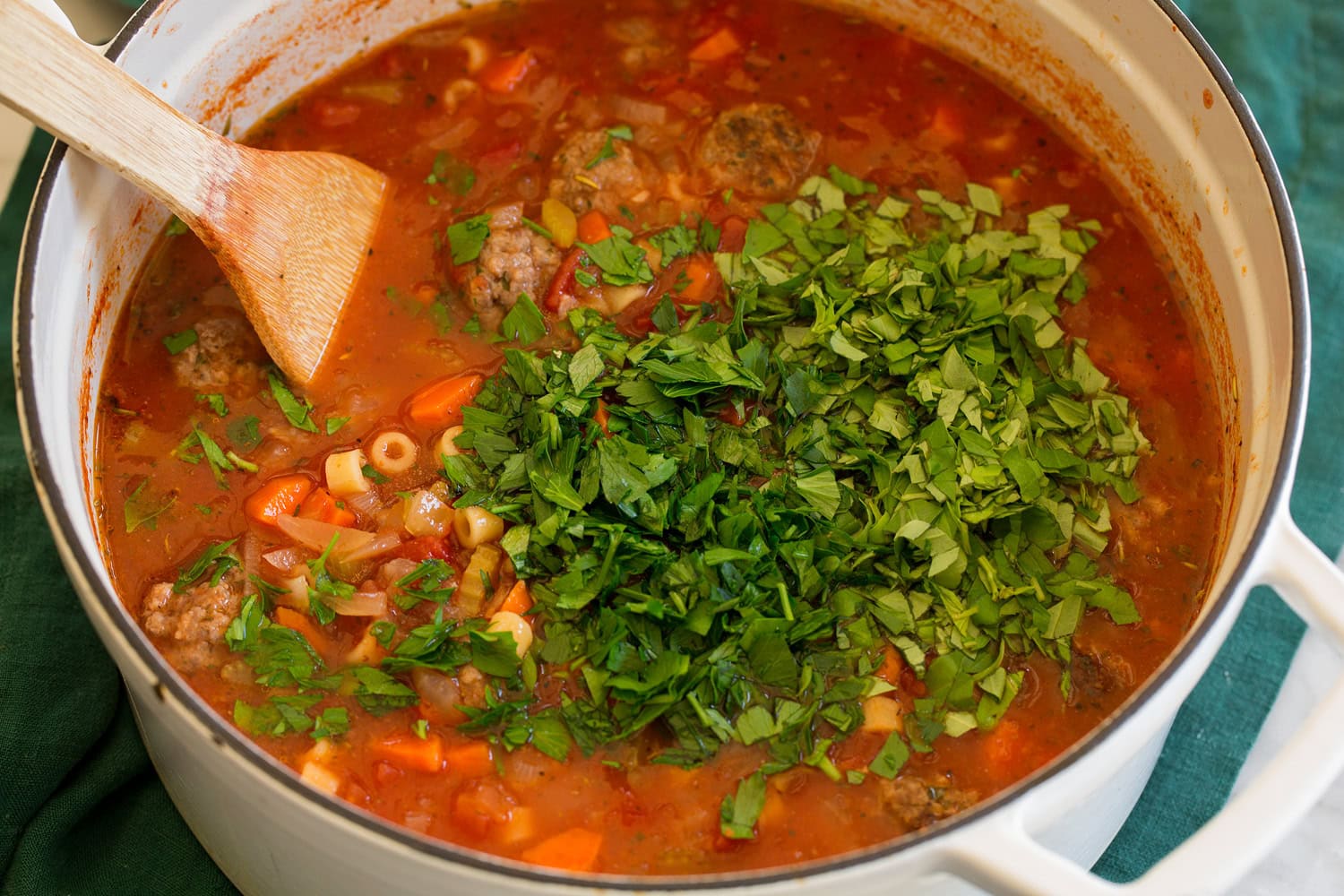 Herbs added to soup.