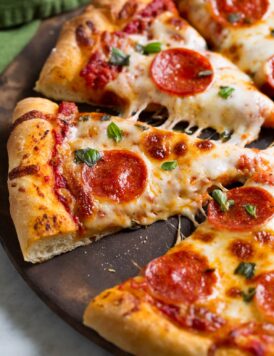 Slices of pepperoni pizza made with a homemade pizza dough recipe.