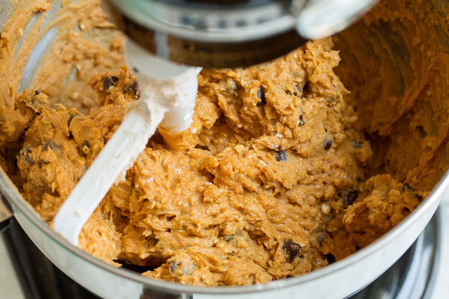 Completed pumpkin cookie dough in stand mixer.