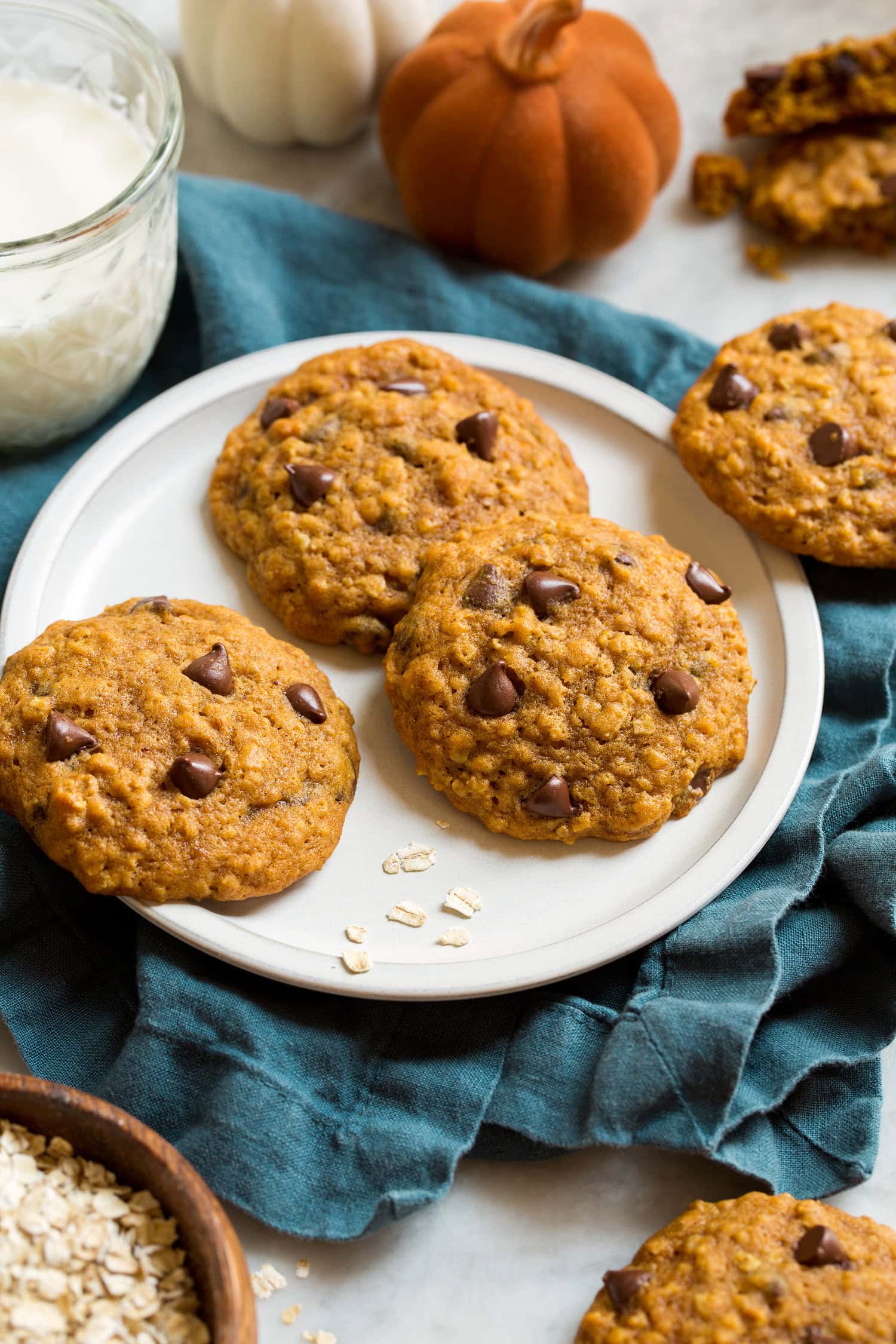 Pumpkin oatmeal cookies on small white plate. 