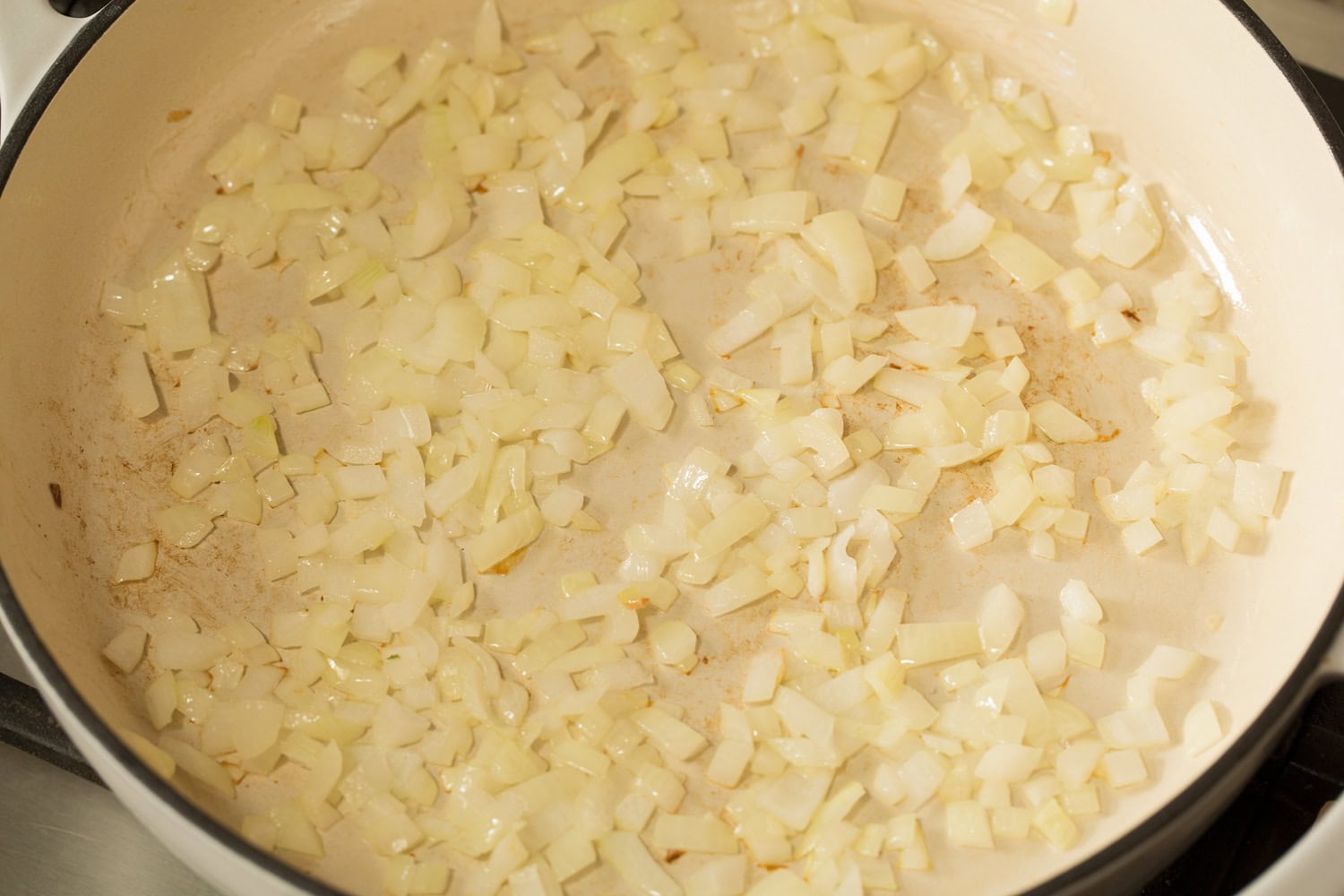 Sauteing onions in skillet.