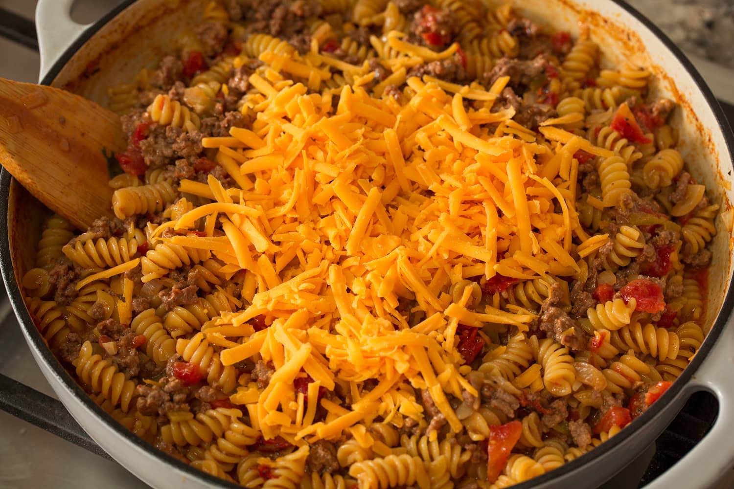 Cheese added to taco pasta.