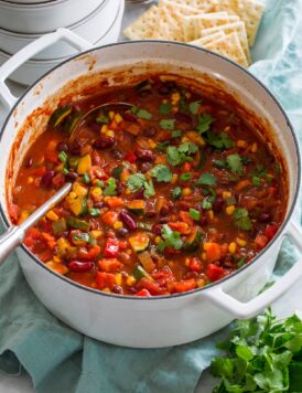 Vegetarian chili in a large white pot.